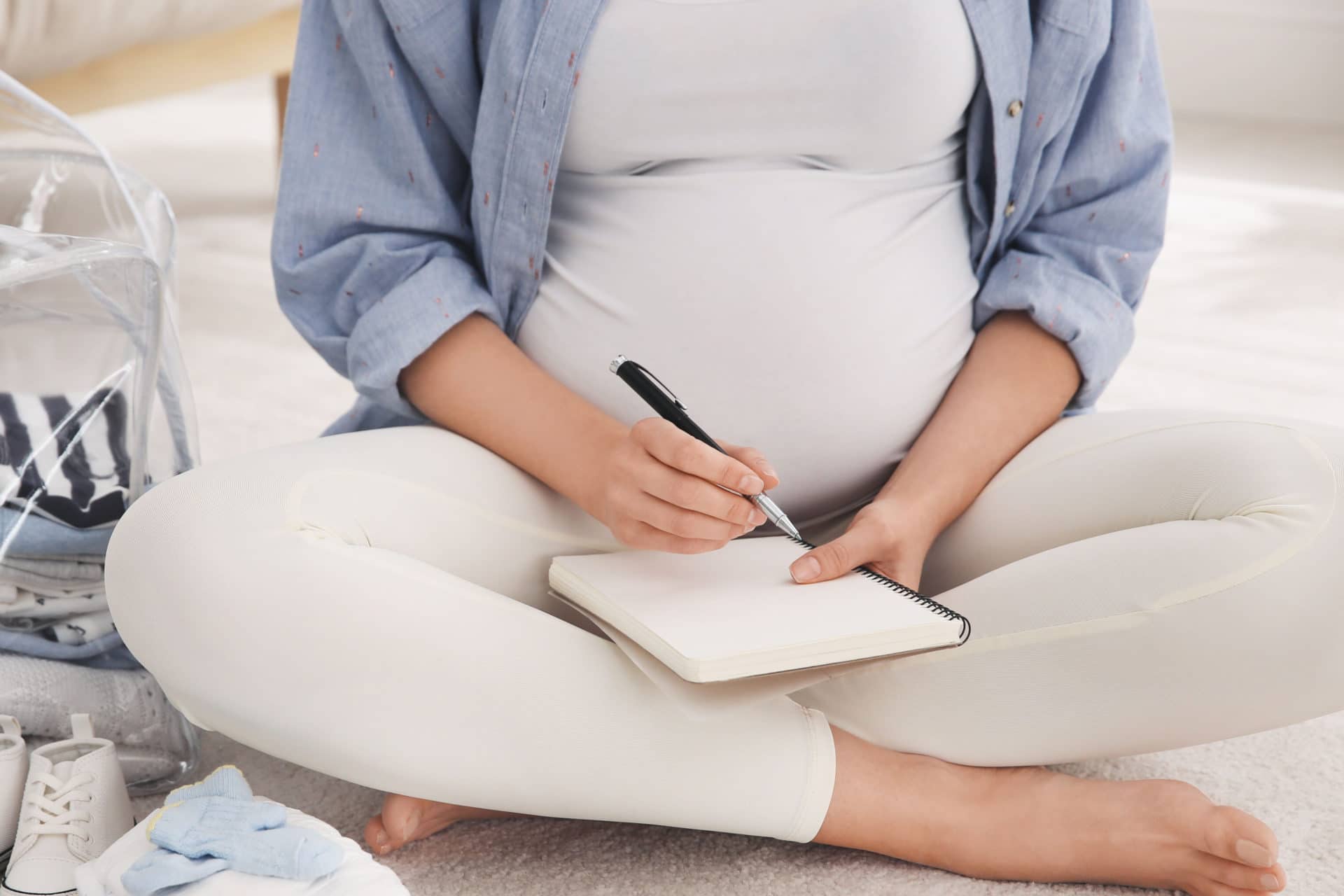 Pregnant lady journaling, logging