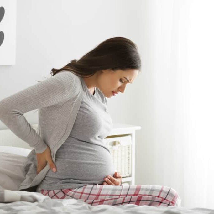 Pregnant woman suffering from pain