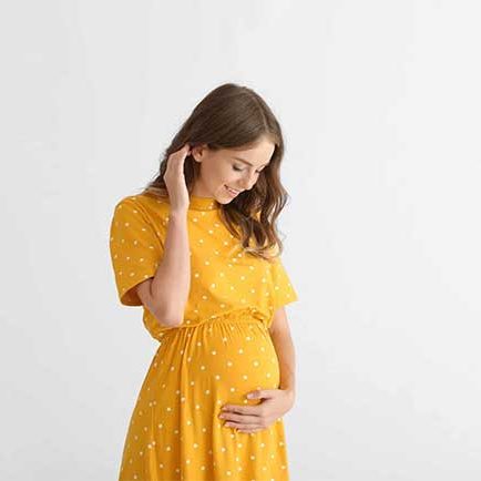 Pregnant woman in yellow dress